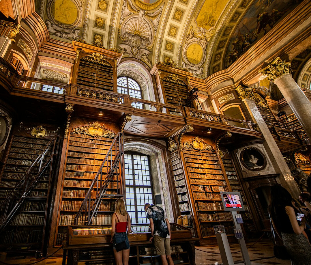 Old library with tall wooden bookshelves