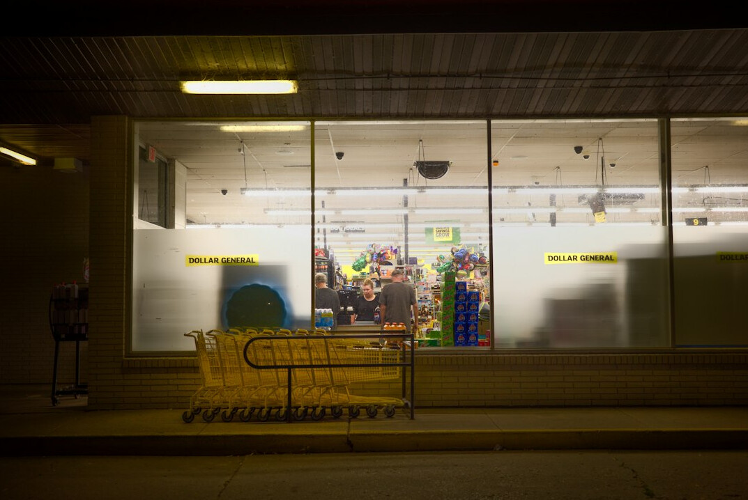 empty supermarket aisle at night