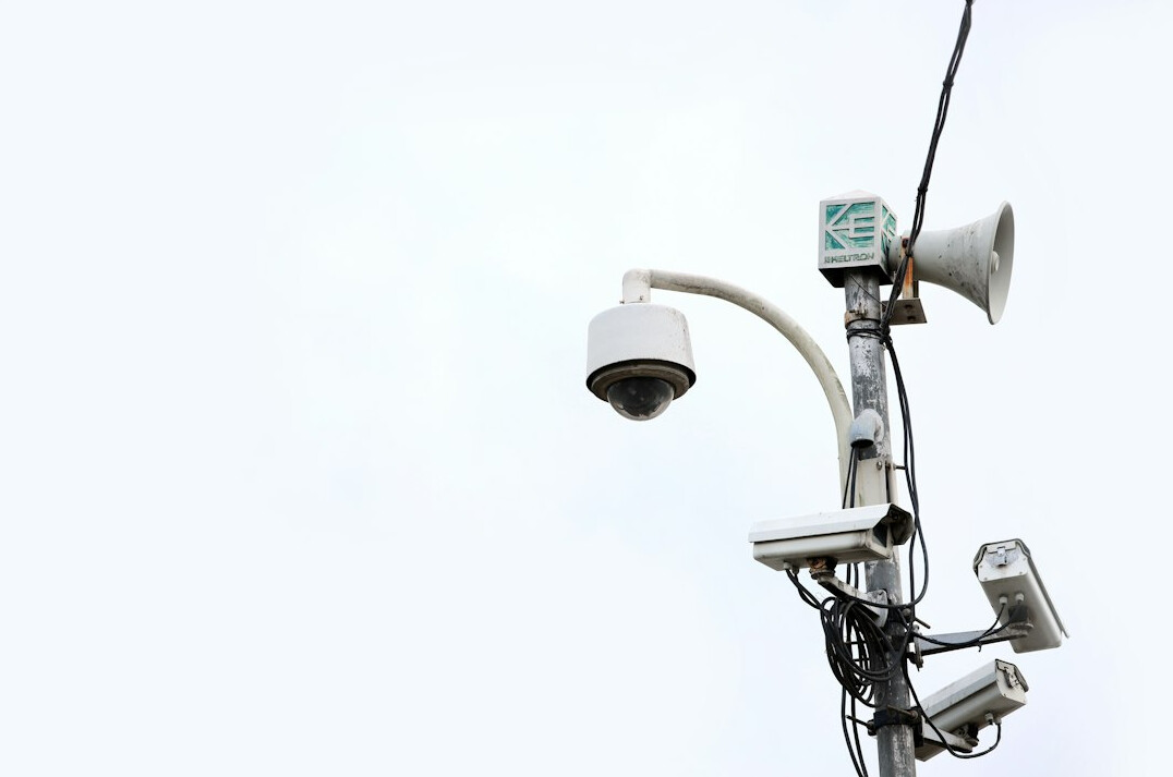 store security guard monitoring cameras