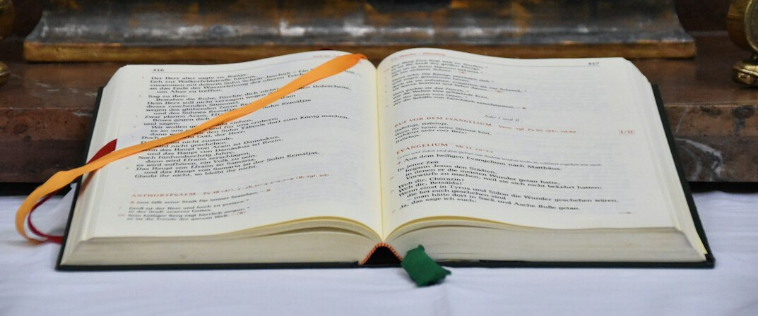 Open antique book on a wooden table