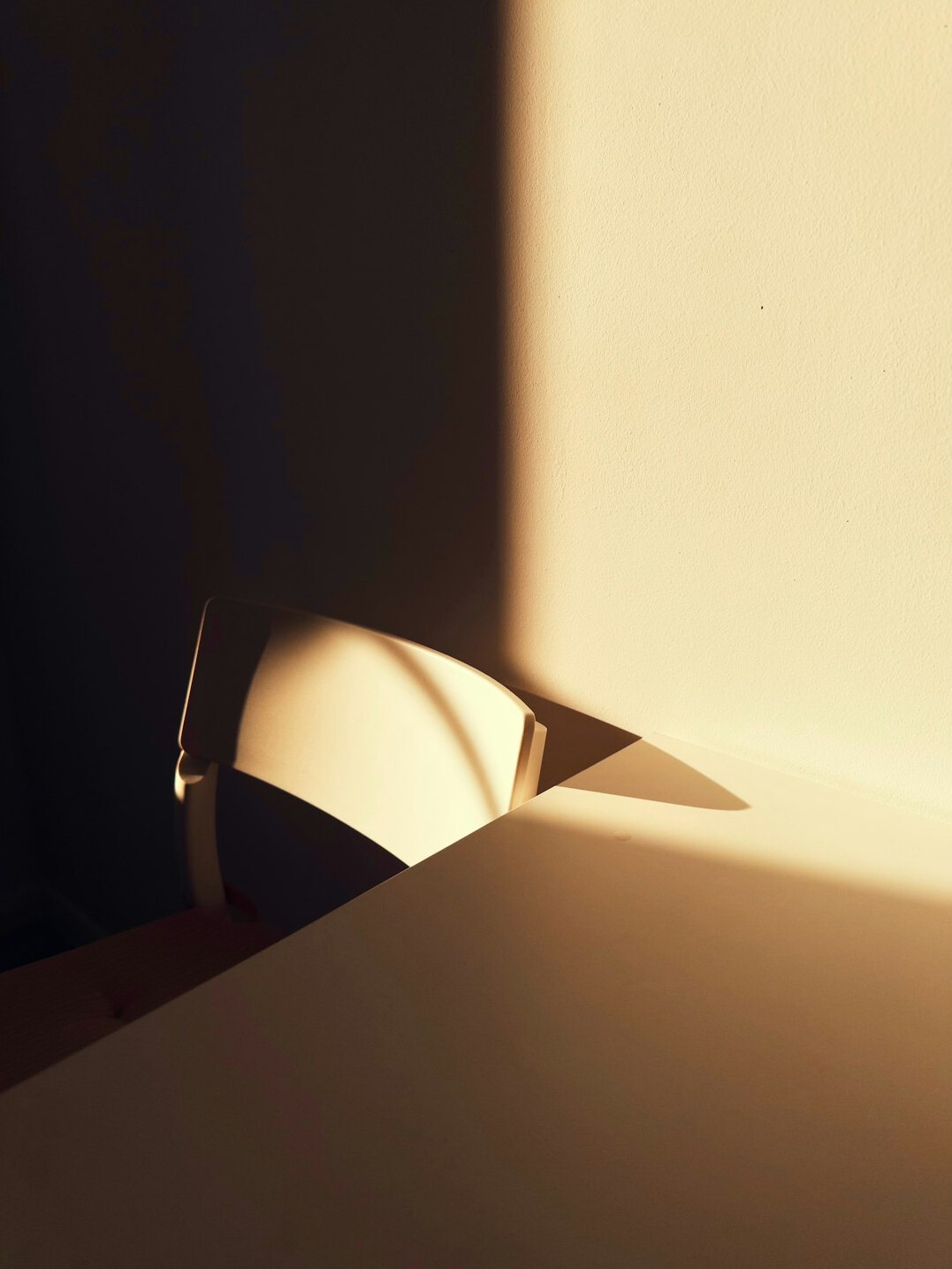 Desk with laptop and notebook in warm light