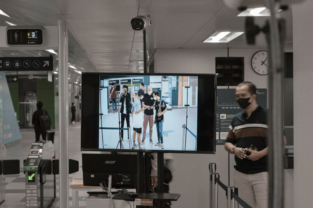 store security guard monitoring cameras